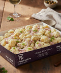 Creamy baby potato salad with red onion and chives in Hannah’s Kitchen branded box – Cork catering and delivery