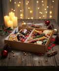 Festive Christmas grazing box with artisan meats, cheeses, crackers, and holiday treats on a rustic wooden table, styled with candles, holly, and fairy lights – Hannah’s Kitchen Cork