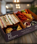 Evening tea box with sandwiches, chicken wings, cupcakes and treats from Hannah’s Kitchen Cork.