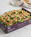 Fresh broccoli and carrot salad with red onion, sunflower seeds, and raisins in Hannah’s Kitchen catering tray – Cork catering salads