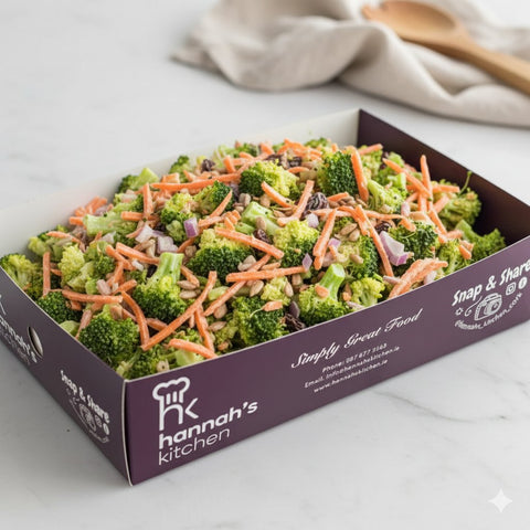 Fresh broccoli and carrot salad with red onion, sunflower seeds, and raisins in Hannah’s Kitchen catering tray – Cork catering salads