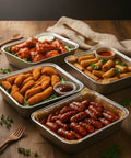 Catering finger food selection with chicken wings, goujons, cocktail sausages, and spring rolls from Hannah’s Kitchen Cork.