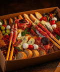 Luxury grazing box with Irish and Italian meats, artisan cheeses, crackers, grapes, and bread — handcrafted by Hannah’s Kitchen Catering Cork