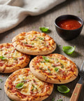 Mini ham and cheese pizzas topped with fresh basil served with tomato dip – party food by Hannah’s Kitchen Catering Cork