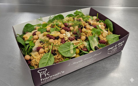 Wholesome couscous and mixed bean salad with spinach, chickpeas, and olives, drizzled with dressing – Hannah’s Kitchen Cork catering