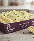 Creamy mashed potato with fresh parsley garnish in Hannah’s Kitchen branded catering tray – freshly made side dish in Cork
