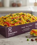 Golden curried rice with peas, peppers, and raisins, served in Hannah’s Kitchen catering tray – flavourful side dish for events in Cork