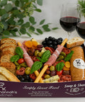 Meat and cheese platter box with crackers, olives and cured meats from Hannah’s Kitchen Cork.