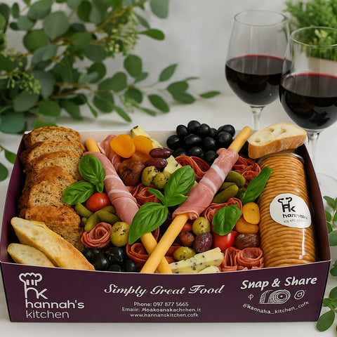 Meat and cheese platter box with crackers, olives and cured meats from Hannah’s Kitchen Cork.