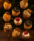 Assorted mini cupcakes with buttercream frosting, biscuits, raspberries, and branded toppers. Handmade by Hannah’s Kitchen Cork