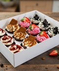 Mixed cupcake box featuring red velvet, Biscoff, Oreo, and strawberry-topped cupcakes. Handmade by Hannah’s Kitchen Cork